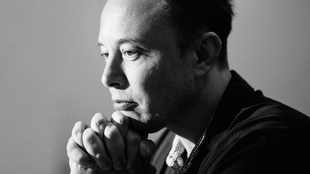 Elon Musk with clasped hands